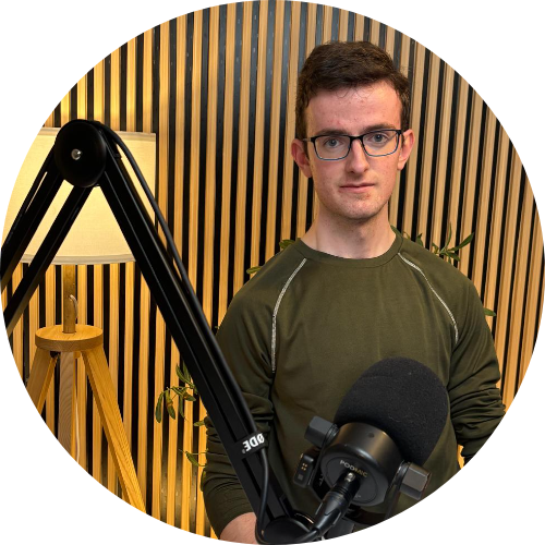 Dan Williams, co-founder of The Coach Trap, at the podcast mic